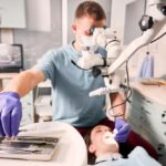 dentist examine a patient's teeth through root canal treatment