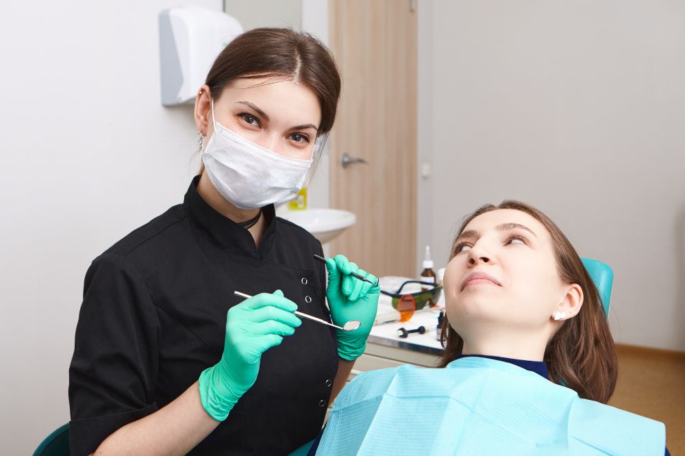 a lady is visiting dental clinic for dental care treatment